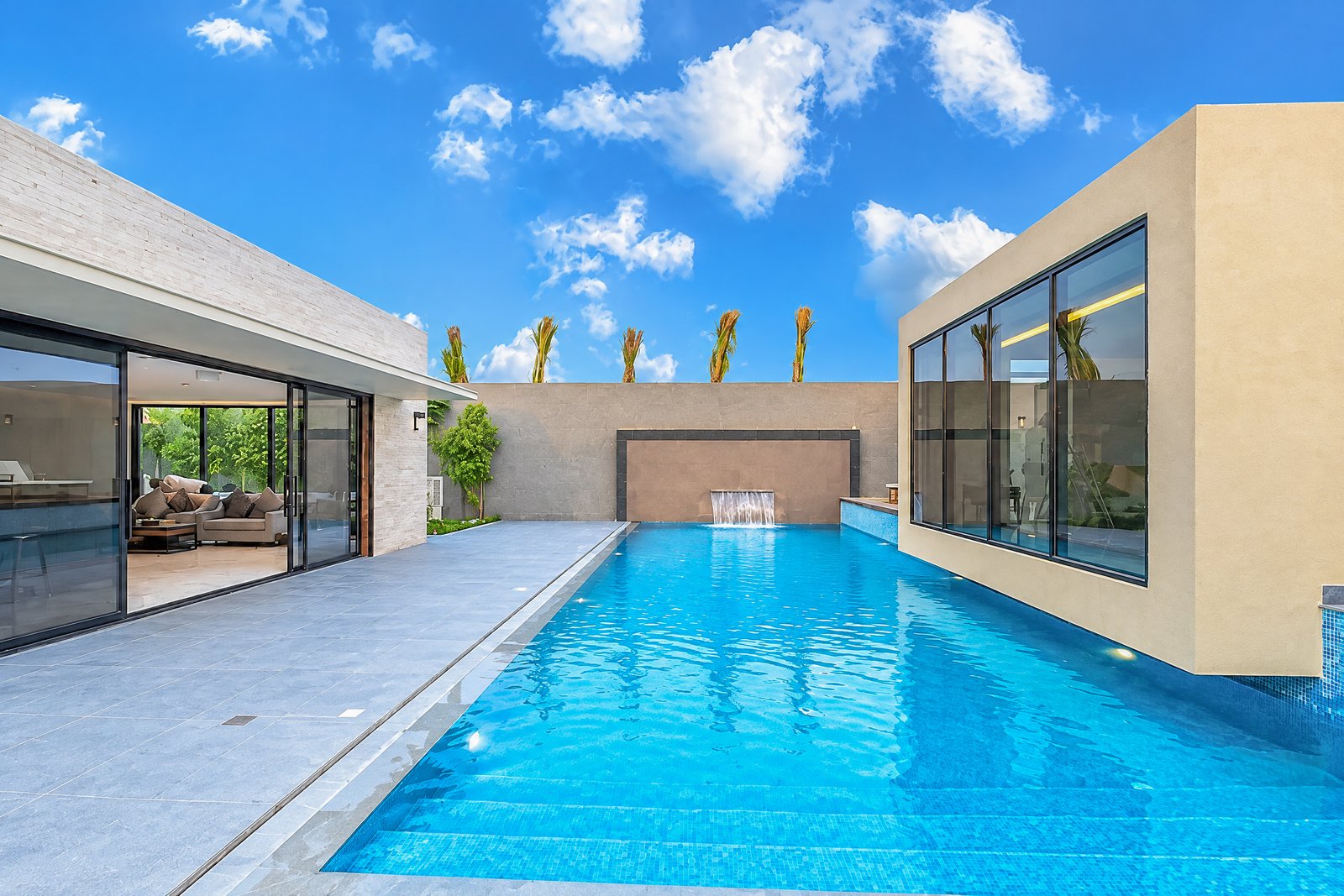 Sunlit resort pool and architecture